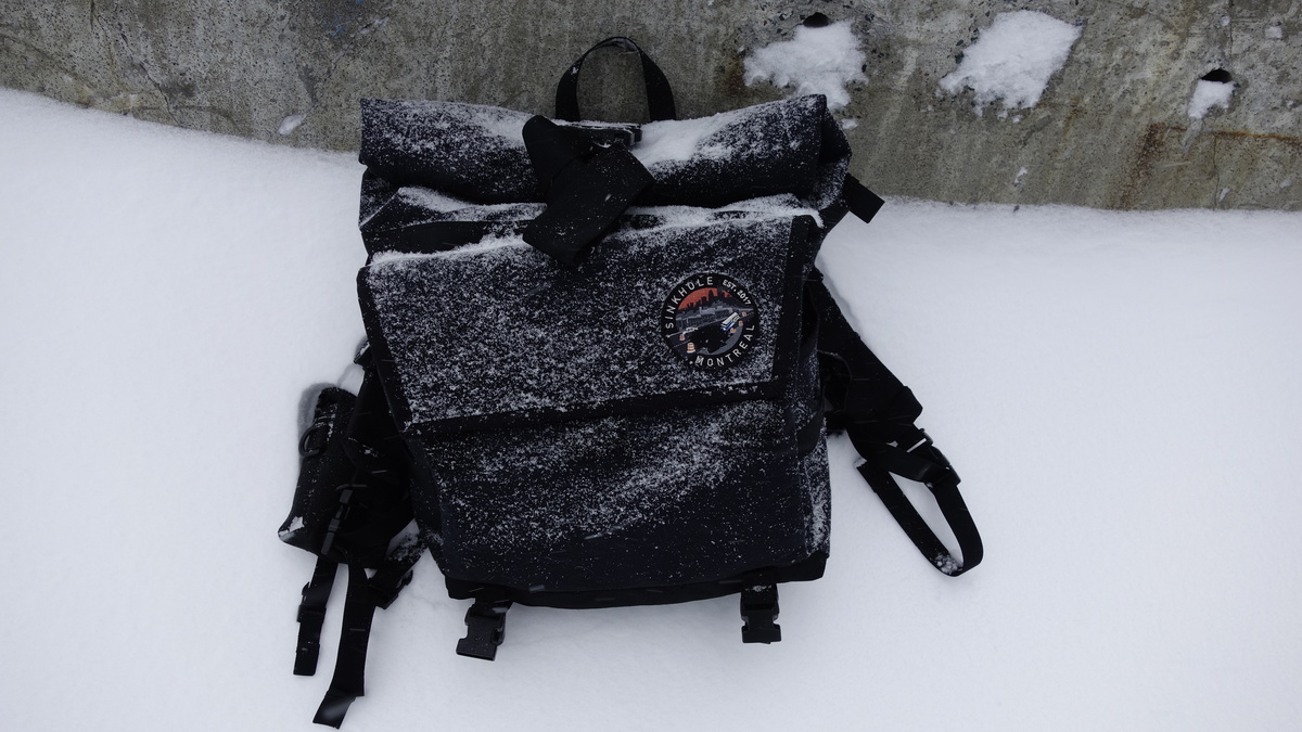 a very snowing black backpack