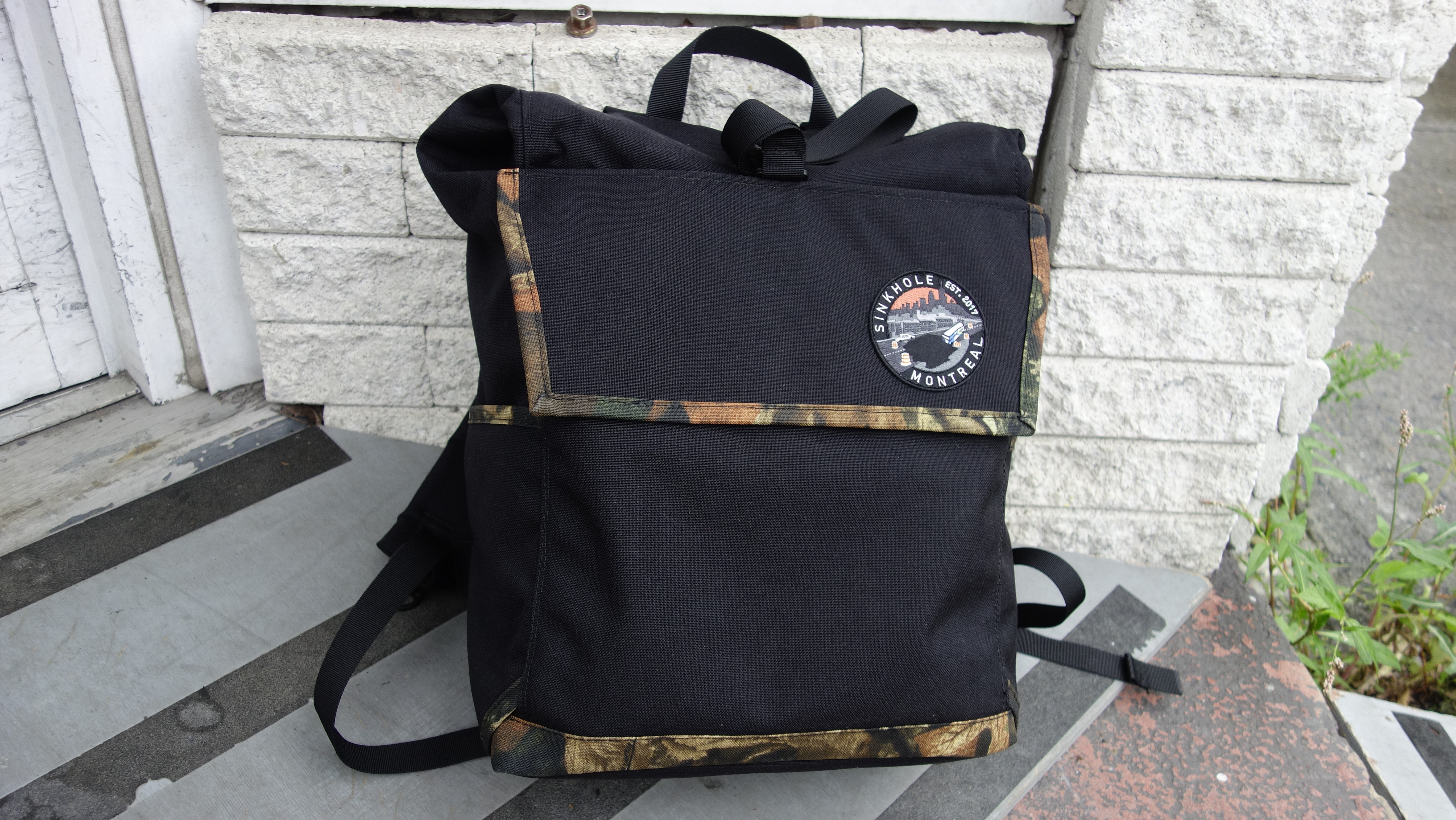 small black backpack with realtree trim